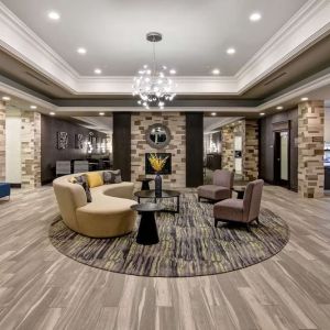 Hotel lobby with lounge area at Homewood Suites By Hilton Burlington.