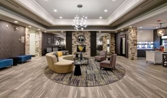 Hotel lobby with lounge area at Homewood Suites By Hilton Burlington.