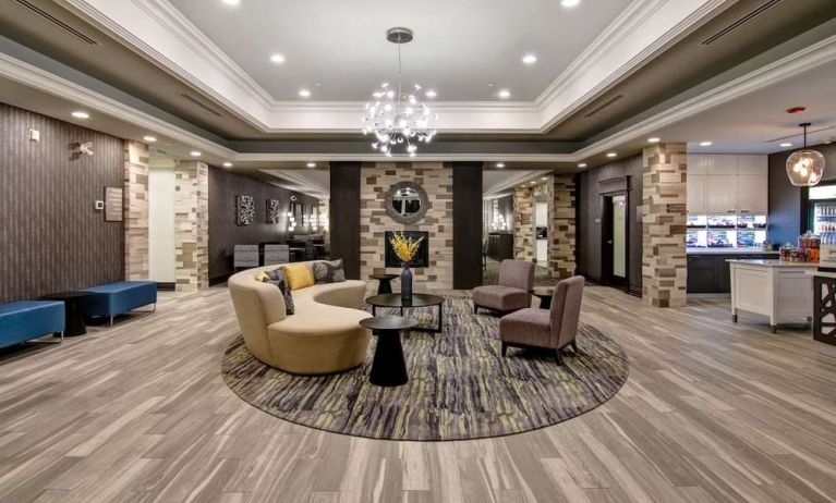 Hotel lobby with lounge area at Homewood Suites By Hilton Burlington.