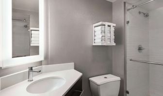 Guest bathroom with shower at Hampton Inn Chicago O`Hare.