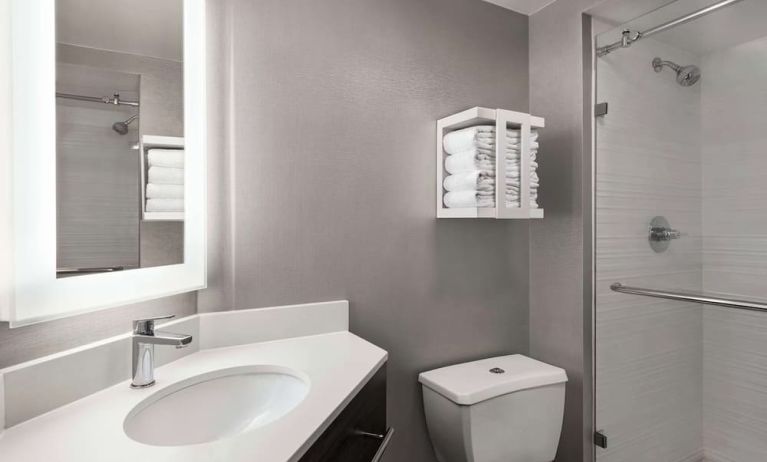 Guest bathroom with shower at Hampton Inn Chicago O`Hare.