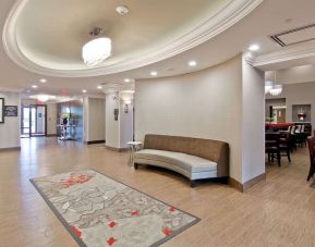 Hotel lobby with lounge area at the Hampton Inn & Suites by Hilton Toronto Markham.