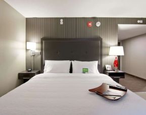 Comfortable king bed at the Hampton Inn & Suites by Hilton Toronto Markham.