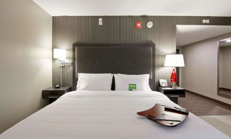 Comfortable king bed at the Hampton Inn & Suites by Hilton Toronto Markham.