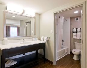 Guest bathroom with toiletries and tub at the Hampton Inn & Suites by Hilton Toronto Markham.