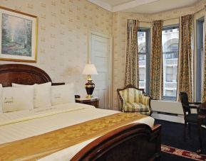 King bedroom with desk at Congress Plaza Hotel.