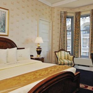 King bedroom with desk at Congress Plaza Hotel.