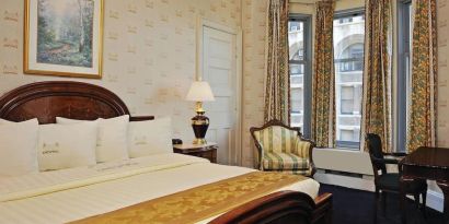 King bedroom with desk at Congress Plaza Hotel.