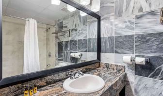 Guest bathroom with shower at Best Western Plus Newark Airport West.