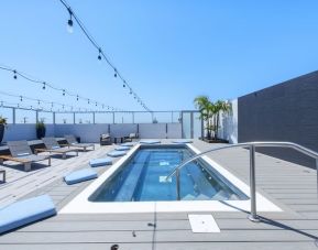 Refreshing outdoor pool and lounge chairs at Shade Hotel Manhattan Beach.