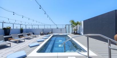 Refreshing outdoor pool and lounge chairs at Shade Hotel Manhattan Beach.