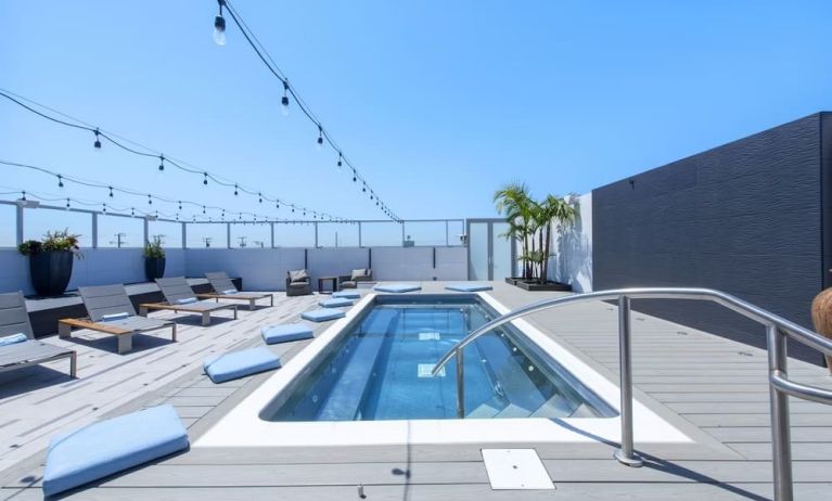 Refreshing outdoor pool and lounge chairs at Shade Hotel Manhattan Beach.