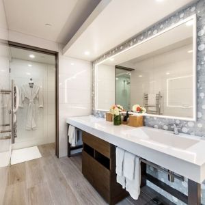 Guest bathroom with shower at Shade Hotel Manhattan Beach.