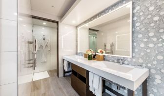 Guest bathroom with shower at Shade Hotel Manhattan Beach.