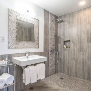 Guest bathroom with shower at Aqua Soleil Hotel & Mineral Water Spa.