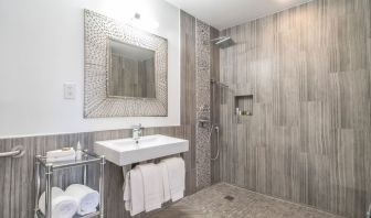 Guest bathroom with shower at Aqua Soleil Hotel & Mineral Water Spa.