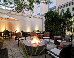 Hotel patio with fire place at Hilton Garden Inn Toronto/Burlington.