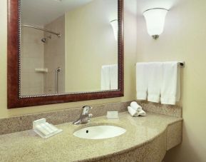 Day use bathroom with shower and toiletries at Hilton Garden Inn Toronto/Burlington.