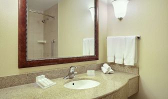 Day use bathroom with shower and toiletries at Hilton Garden Inn Toronto/Burlington.