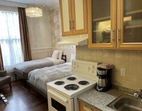 Twin room with in-room kitchen at Parc Suites Hotel.