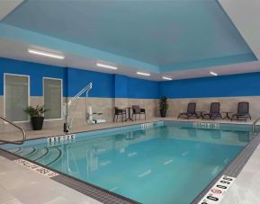 Relaxing indoor pool with lounge area at Hampton Inn By Hilton Port Hope.