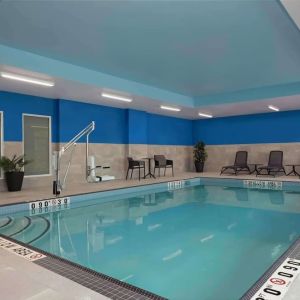 Relaxing indoor pool with lounge area at Hampton Inn By Hilton Port Hope.