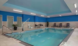 Relaxing indoor pool with lounge area at Hampton Inn By Hilton Port Hope.