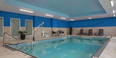 Relaxing indoor pool with lounge area at Hampton Inn By Hilton Port Hope.