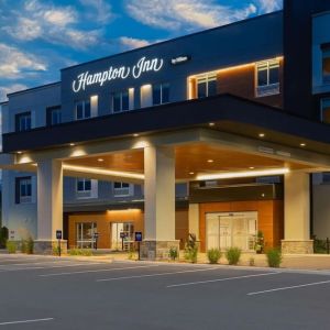 Hotel exterior and parking area at Hampton Inn By Hilton Port Hope.