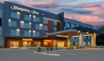 Hotel exterior and parking area at Hampton Inn By Hilton Port Hope.