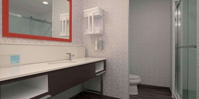 Private guest bathroom with toiletries at Hampton Inn By Hilton Port Hope.