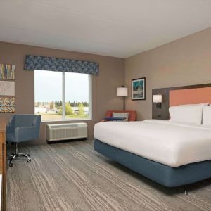 Day use king room with TV and work desk at Hampton Inn By Hilton Port Hope.