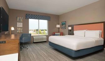 Day use king room with TV and work desk at Hampton Inn By Hilton Port Hope.