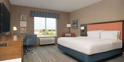 Day use king room with TV and work desk at Hampton Inn By Hilton Port Hope.