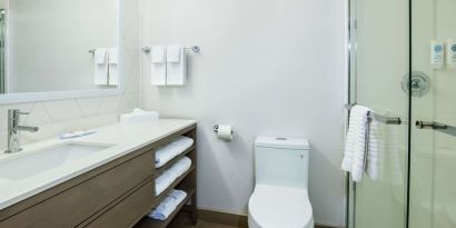 Private guest bathroom with shower and toiletries at Comfort Inn & Suites Barrie.