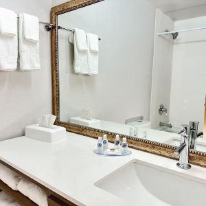 Private guest bathroom with shower and tub at Comfort Inn & Suites Barrie.