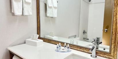 Private guest bathroom with shower and tub at Comfort Inn & Suites Barrie.