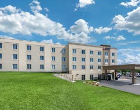 Hotel exterior and parking area at Comfort Inn & Suites Napanee.