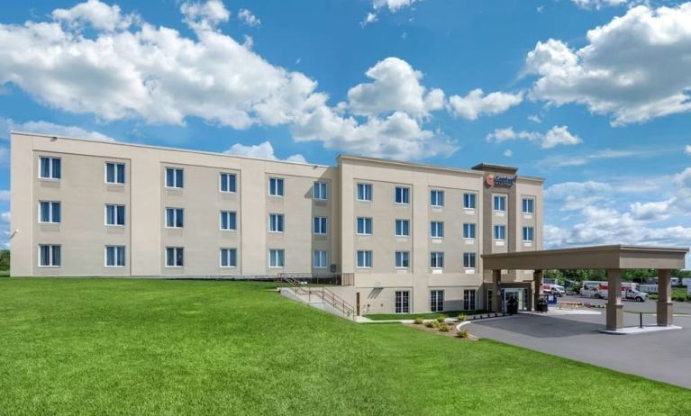 Hotel exterior and parking area at Comfort Inn & Suites Napanee.