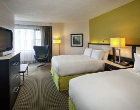 Day use twin room with TV and seating  at The Hollis Halifax - A DoubleTree Suites By Hilton.