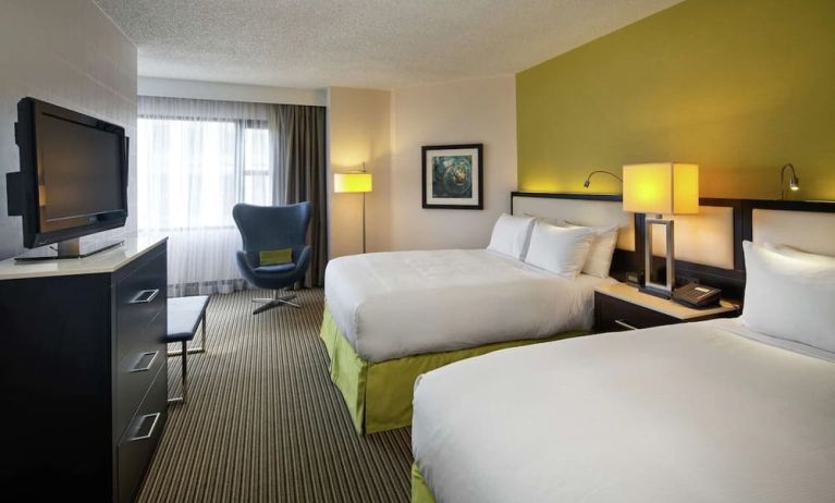 Day use twin room with TV and seating  at The Hollis Halifax - A DoubleTree Suites By Hilton.