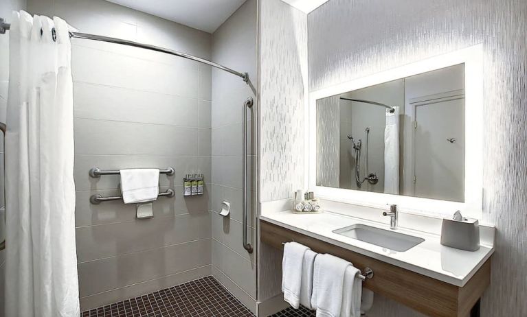 Day use guest bathroom with shower and toiletries at Holiday Inn Express & Suites Airport-Calgary.