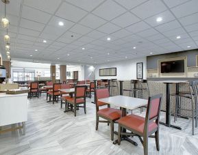 Dining area with comfortable mobiliary perfect for co-working at Holiday Inn Express & Suites Airport-Calgary.