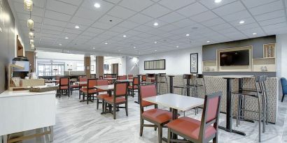 Dining area with comfortable mobiliary perfect for co-working at Holiday Inn Express & Suites Airport-Calgary.