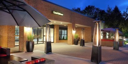 Outdoor seating at night at Boston Marriott Burlington.