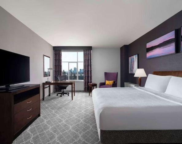 Bright and spacious day use room with King Bed, TV, work desk and private bathroom at Hilton Garden Inn Calgary Airport.