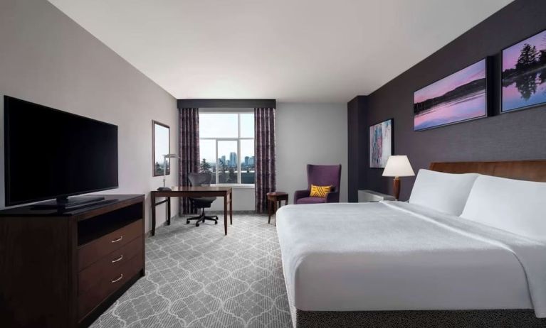 Bright and spacious day use room with King Bed, TV, work desk and private bathroom at Hilton Garden Inn Calgary Airport.