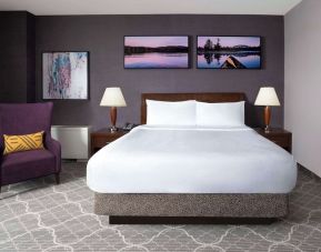 Standard day use room with queen bed, work desk and private bathroom at Hilton Garden Inn Calgary Airport.