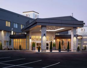 Hotel entrance and parking area at DoubleTree By Hilton Montreal Airport.