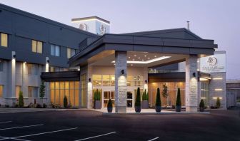 Hotel entrance and parking area at DoubleTree By Hilton Montreal Airport.